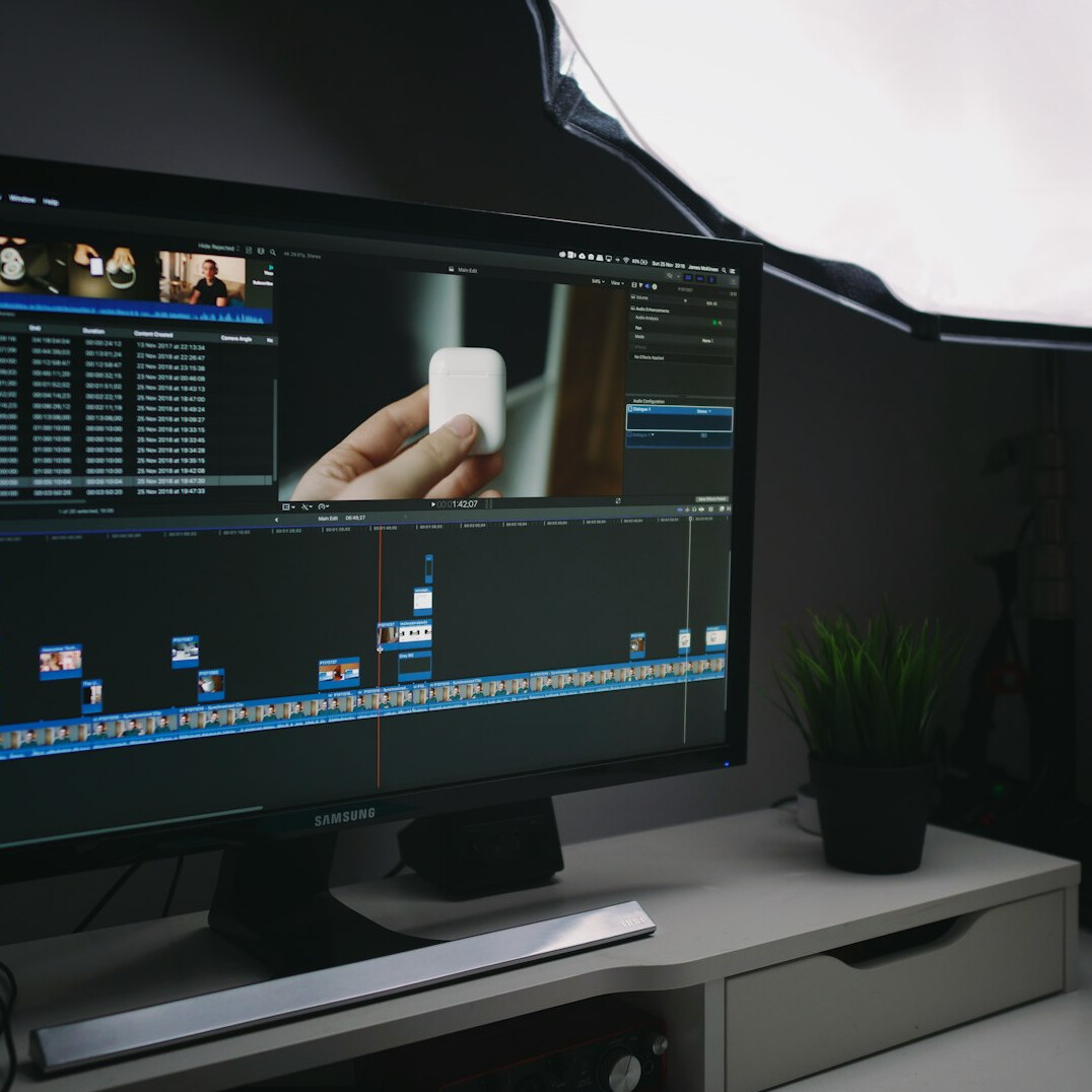 professional video editor at desk