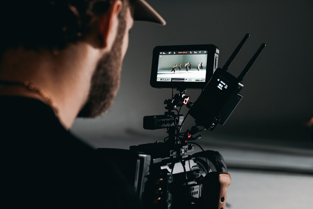 advanced filmmaker reviewing footage