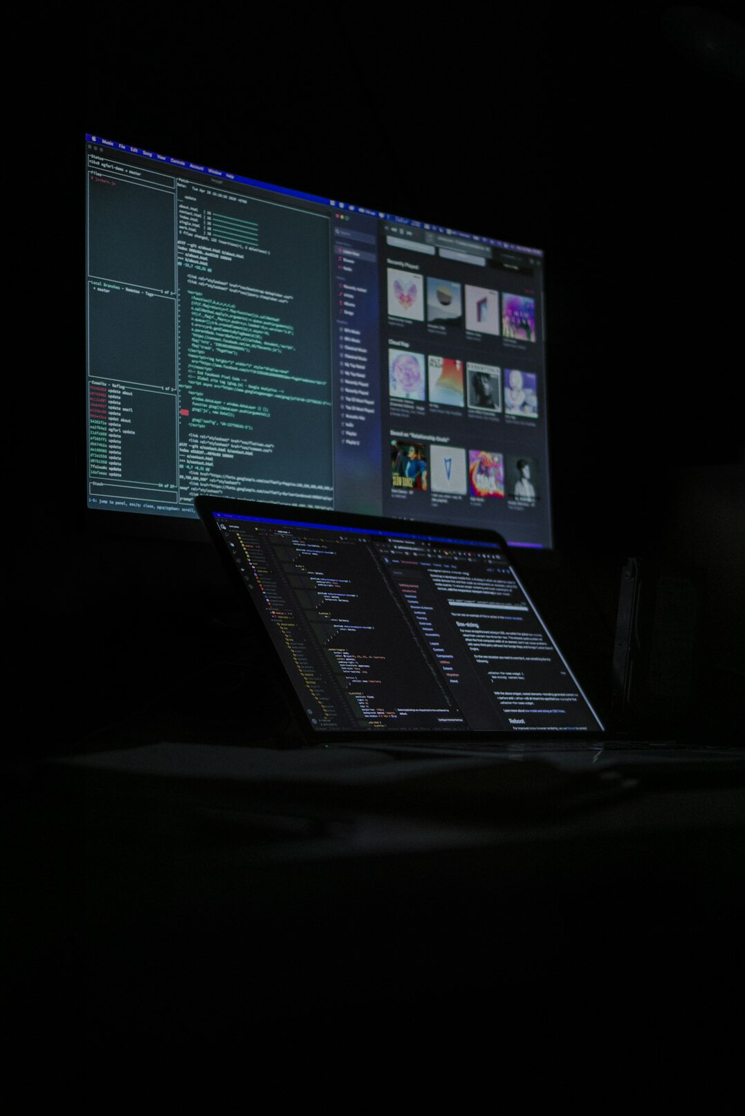Video editor working at a multi-monitor workstation