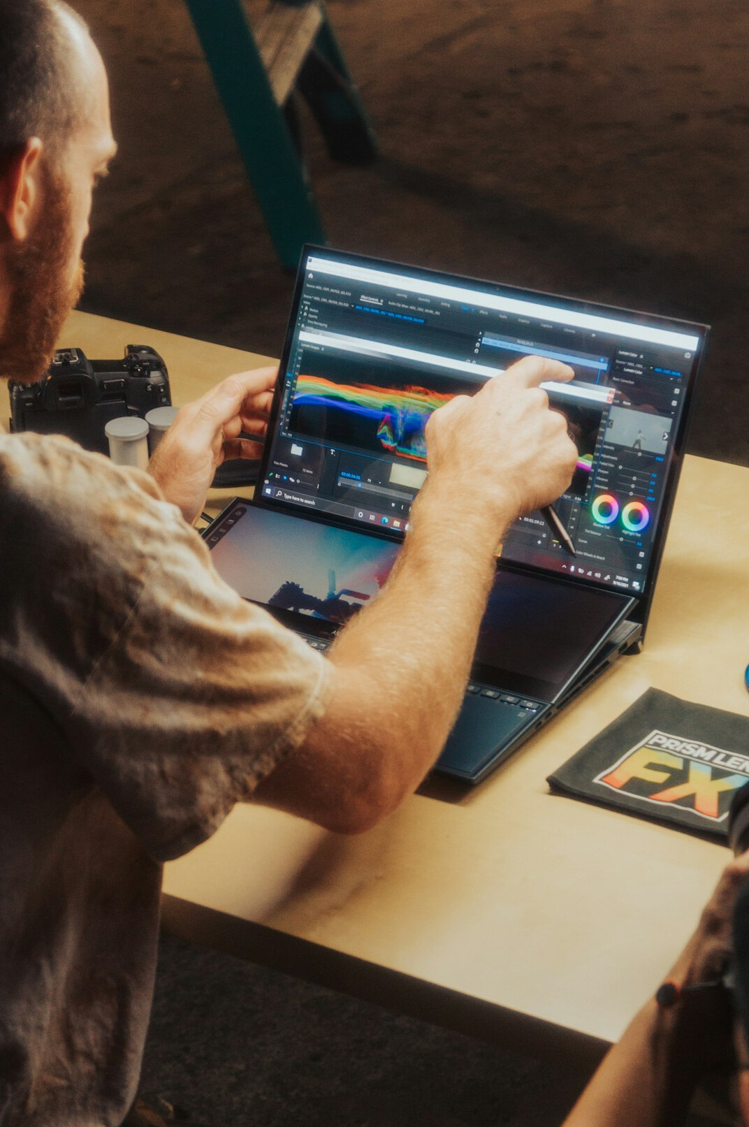 filmmaker editing video on laptop