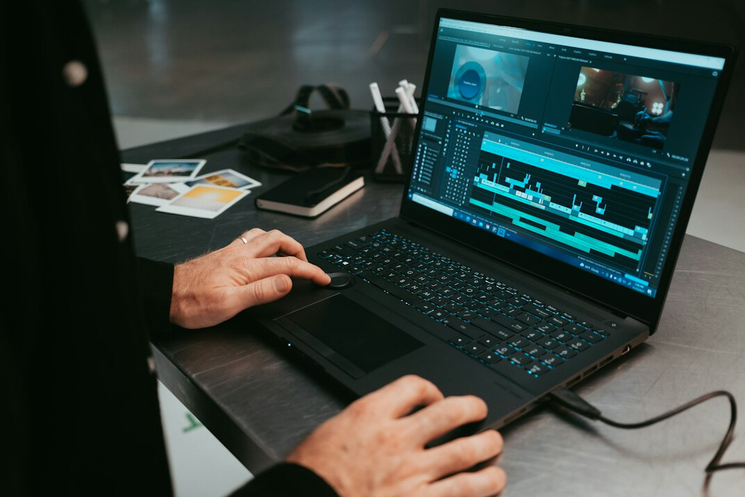 person using laptop for editing