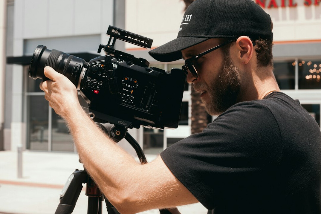 filmmaker with camera on set